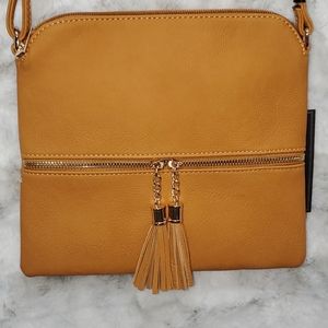 Mustard color tassels zipper pocket in front.